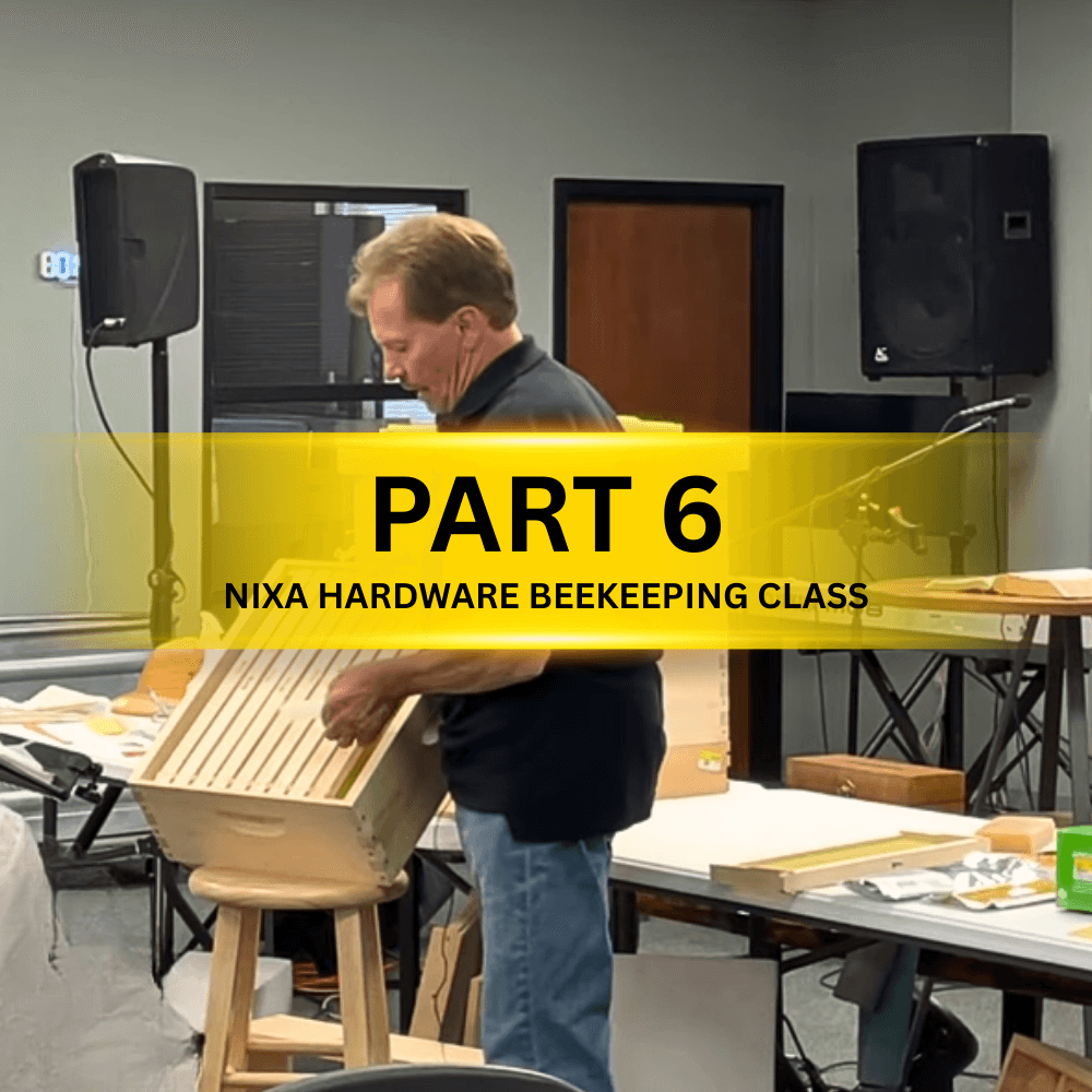 Dan Barton showing a honey super frame and discussing nectar flows in the Ozarks.